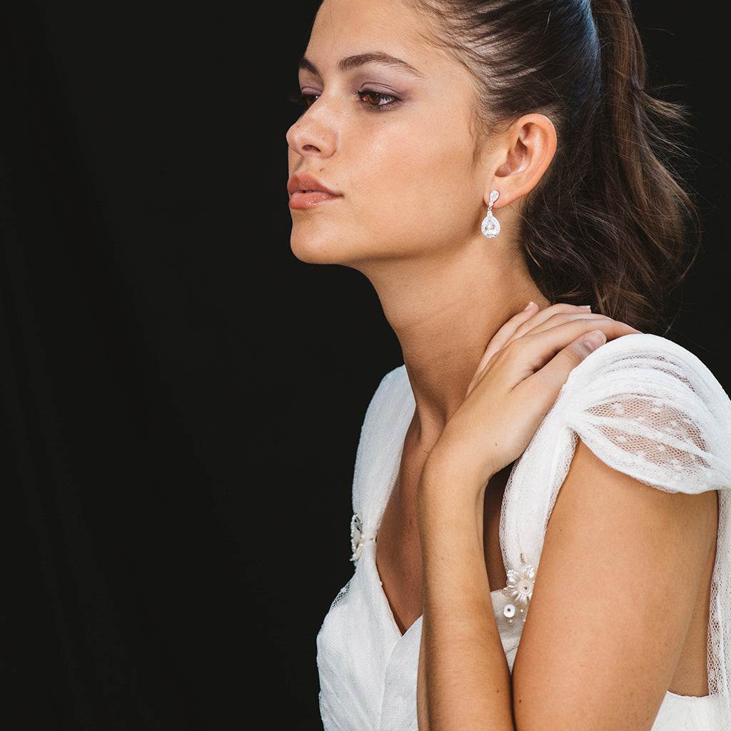 Silver water drop earrings with white zircons