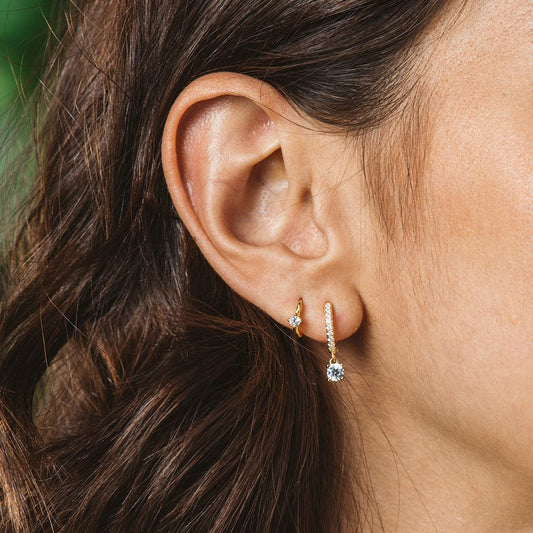 Silver and gold earrings with zircons