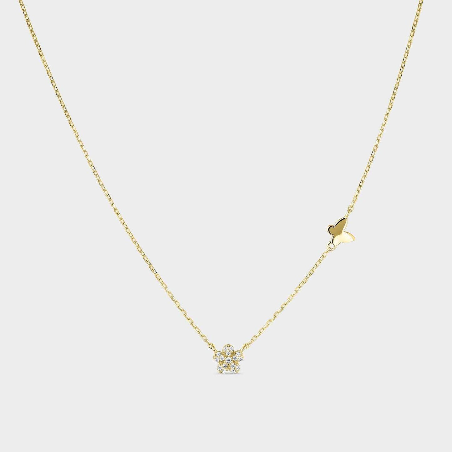 Collar de plata bañada en oro amarillo con motivo de mariposa y flor con circonitas blancas