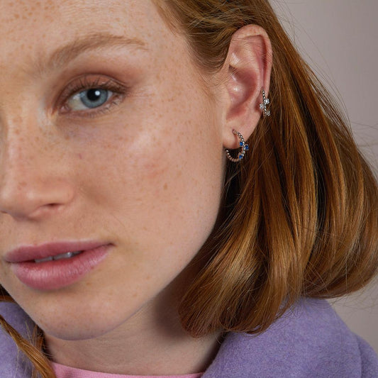 Silver hoop earrings with blue zircons