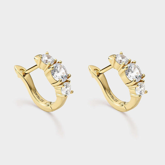 Kreolische Ohrringe aus gelbvergoldetem Silber mit drei weißen Zirkonen und katalanischem Verschluss