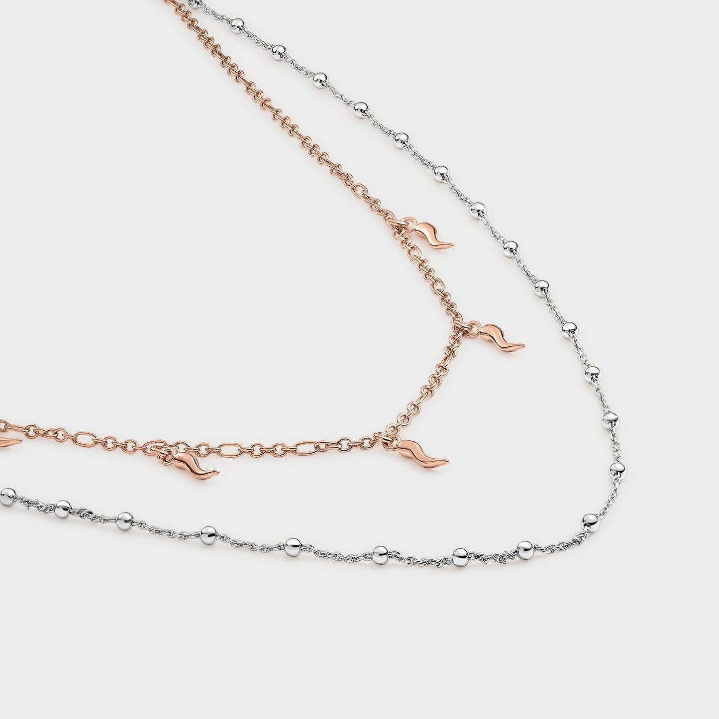 Bicolor double necklace with fangs