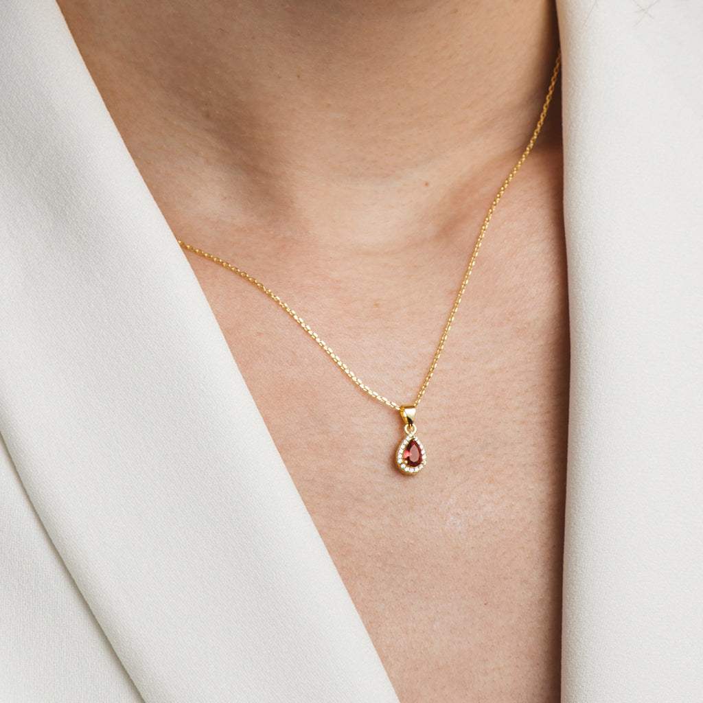 Gold plated necklace and earrings set with white and red zircons