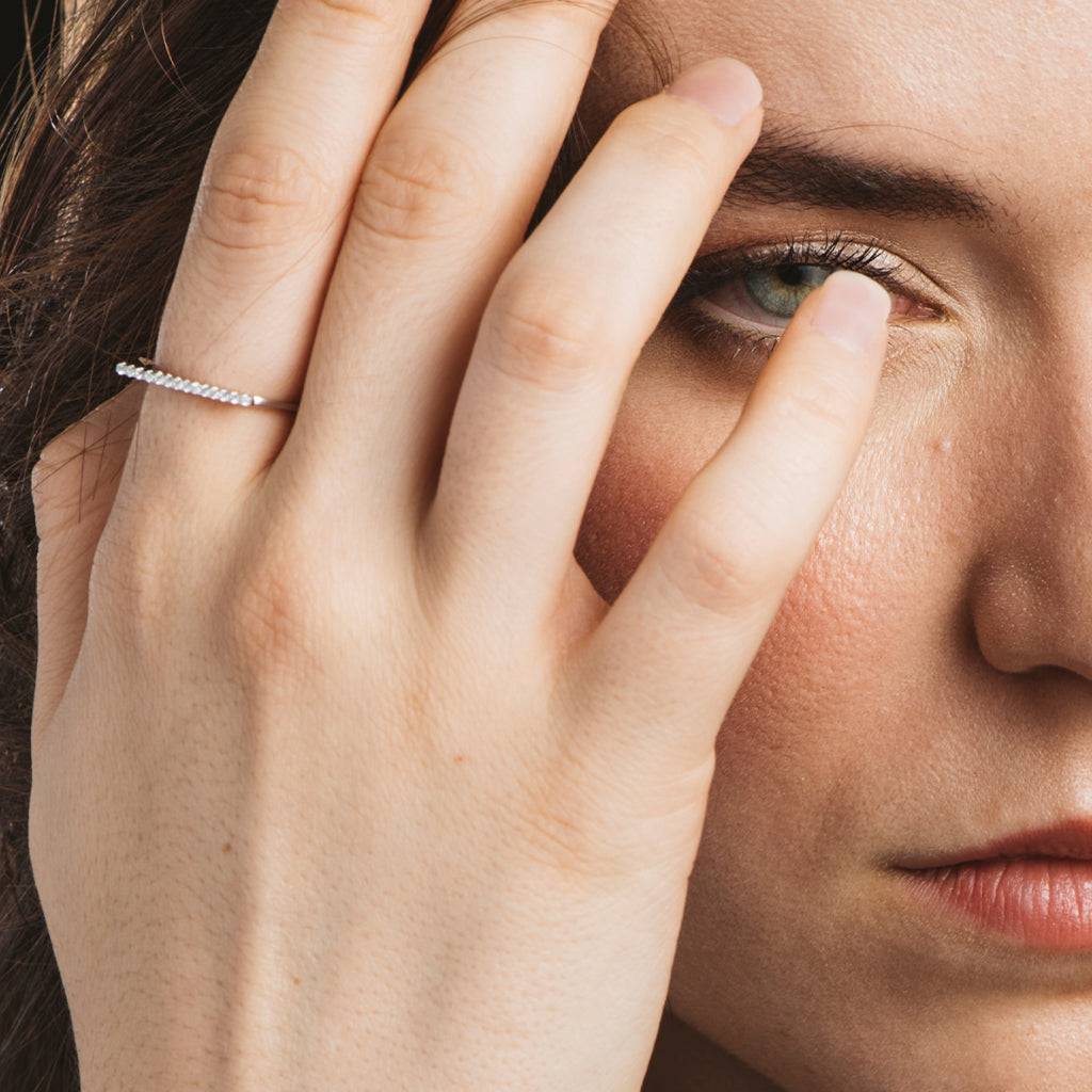 Silver ring and zircons in a row