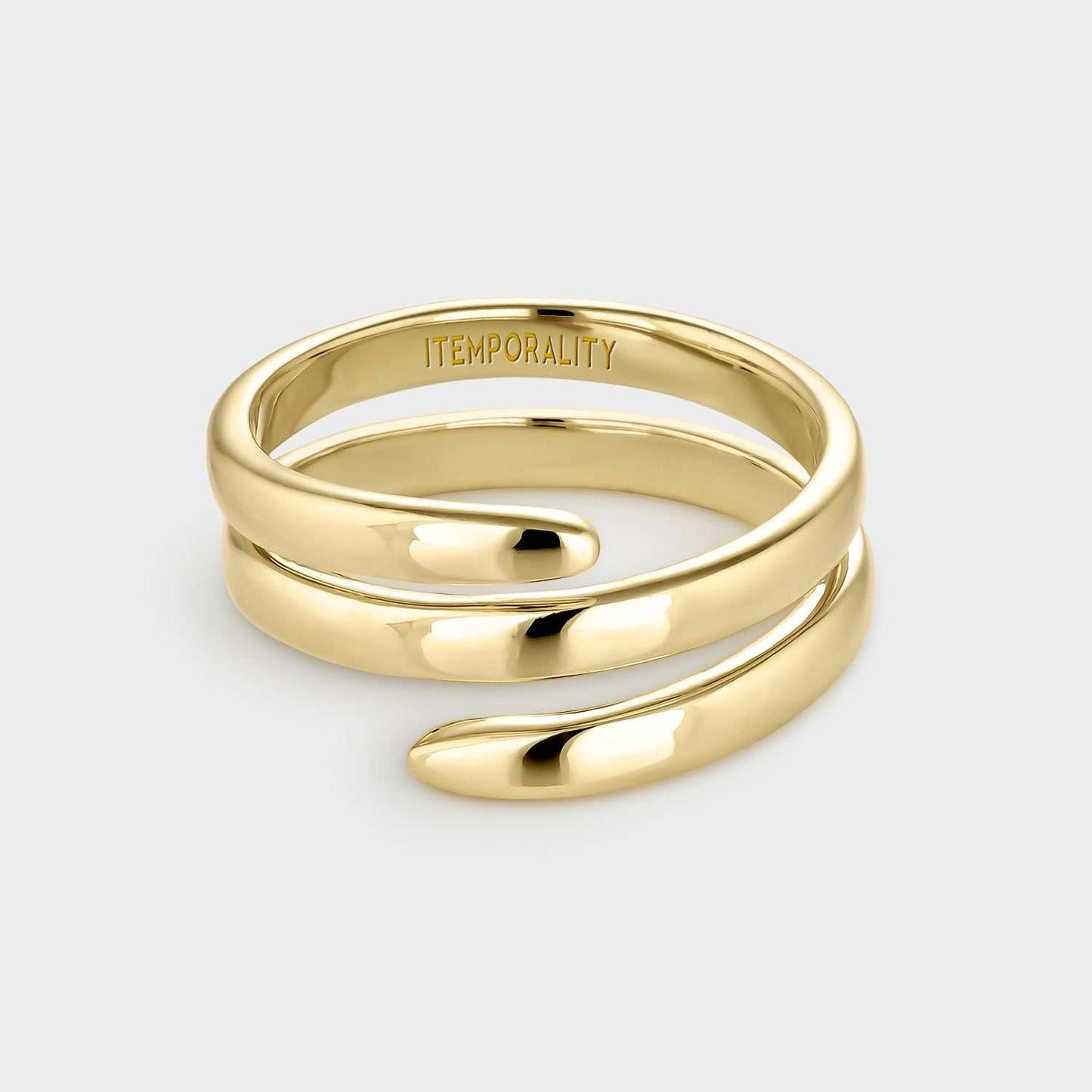 Anillo de plata bañada en oro amarillo con forma de espiral