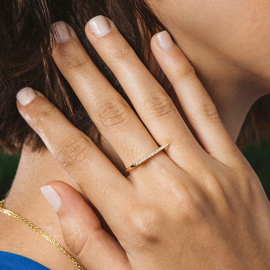 Gold-plated silver ring with zircons in a row